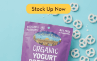 A purple SunRidge Farms Organic Yogurt Pretzels bag with white pretzels scattered around, promoting a 20% off sitewide Labor Day sale with a yellow Stock Up Now button.