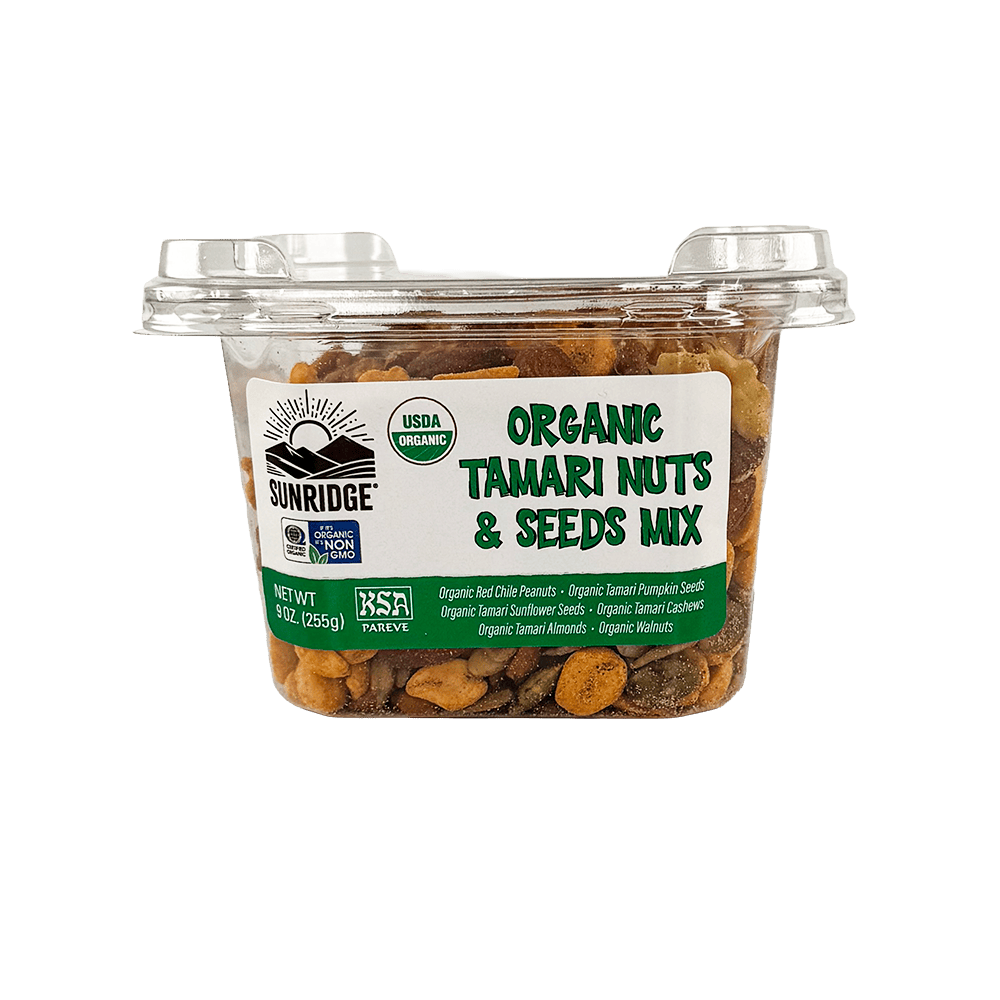 A plastic tub of Organic Tamari Nuts & Seeds Mix - 12 Count, 9 oz. Tub filled with a mix of tamari-coated nuts and seeds.